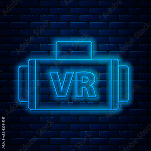 Glowing neon line Virtual reality glasses icon isolated on brick wall background. Stereoscopic 3d vr mask. Vector Illustration