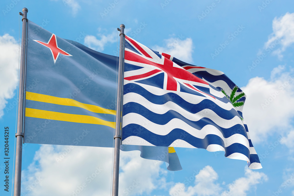 British Indian Ocean Territory and Aruba flags waving in the wind against white cloudy blue sky together. Diplomacy concept, international relations.