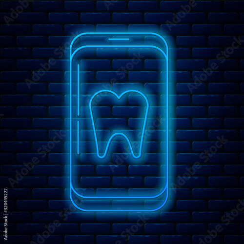 Glowing neon line Online dental care icon isolated on brick wall background. Dental service information call center. Vector Illustration