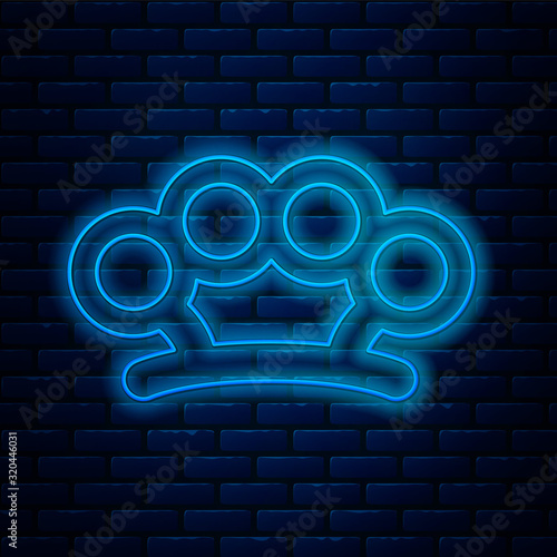 Glowing neon line Brass knuckles icon isolated on brick wall background. Vector Illustration