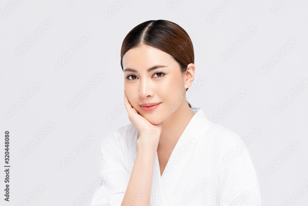 Youthful radiant pretty Asian woman with hand touching face Youthful radiant pretty Asian woman with hand touching face