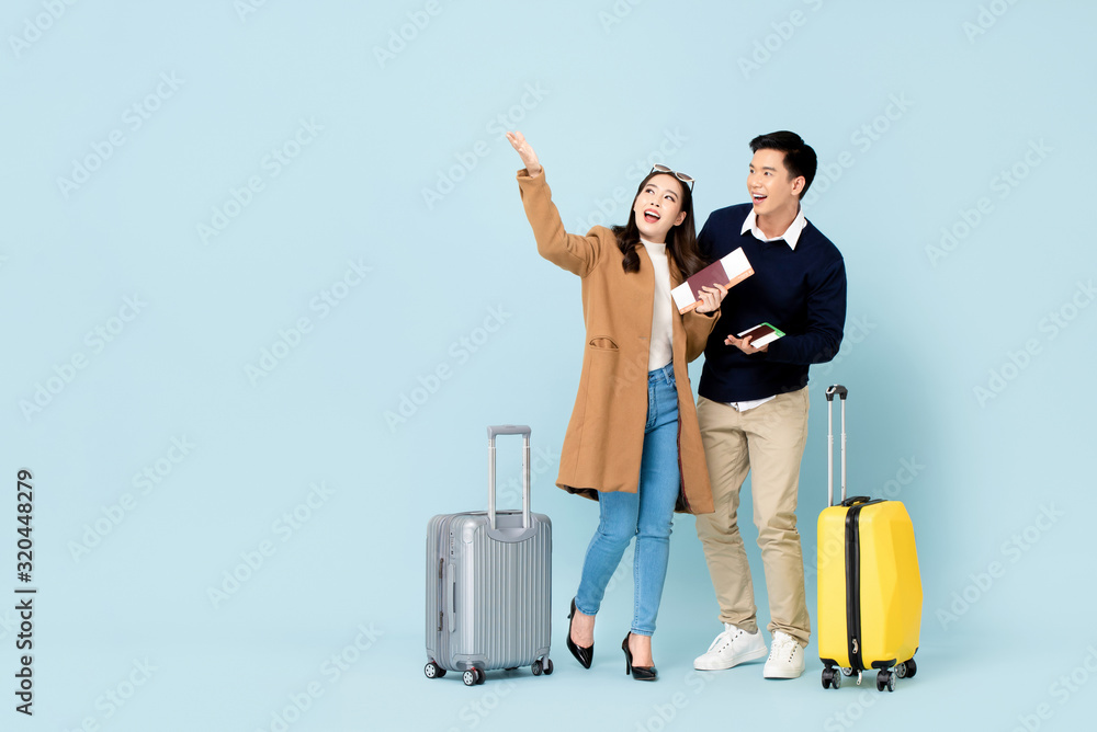 Lovely Asian couple tourists going to travel Lovely Asian couple tourists going to travel