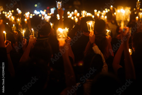 People hand holding candle for pray