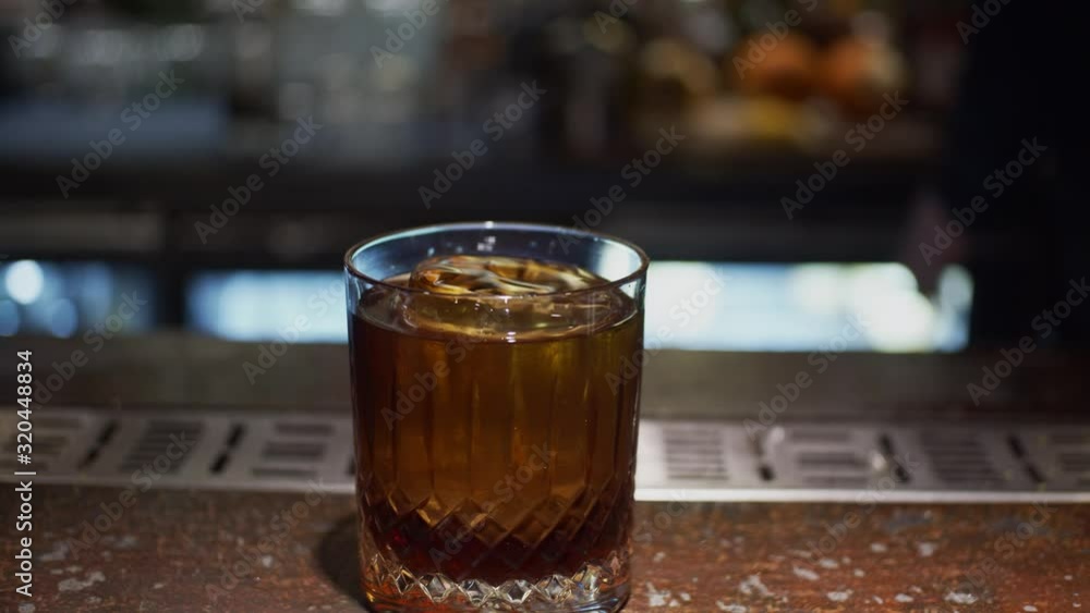 Process of making alcohol cocktail, slow motion, shallow depth of field Process of making alcohol cocktail, slow motion, shallow depth of field