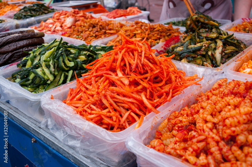 A variety of salads in trays on the counter at the food market in China, street food in the summer © Beliakina Ekaterina