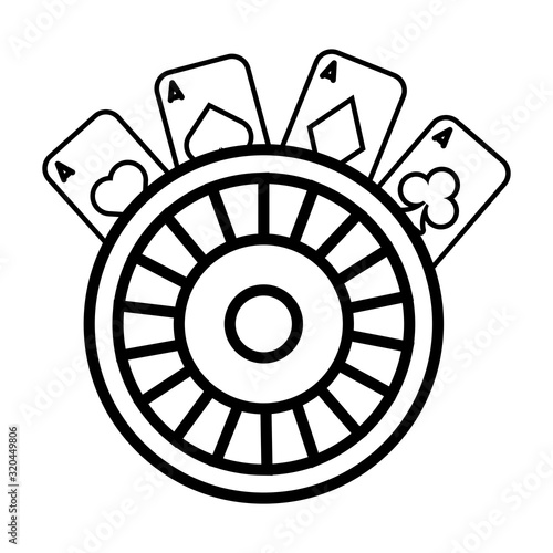 roulette wheel and poker cards casino