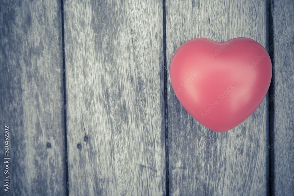 Red heart on wooden table Red heart on wooden table