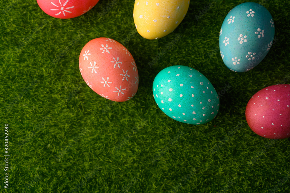 Easter eggs colored on green grass. Congratulations on Easter. Horizontal frame. Easter eggs colored on green grass. Congratulations on Easter. Horizontal frame.