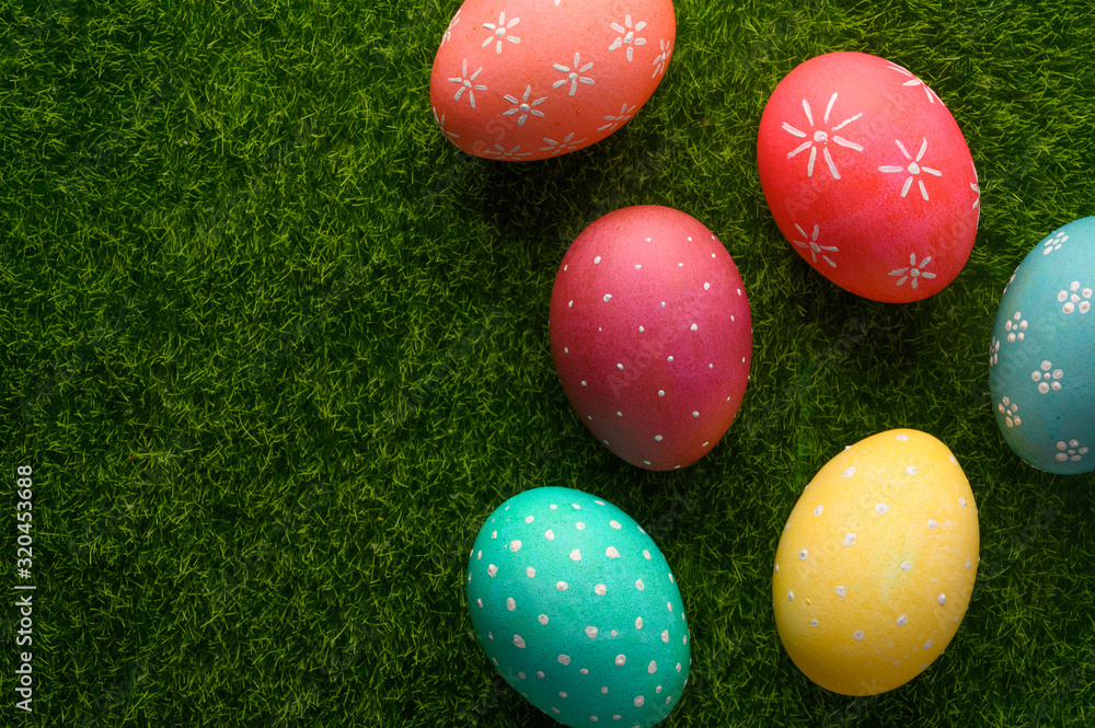 Easter eggs colored on green grass. Congratulations on Easter. Horizontal frame. Easter eggs colored on green grass. Congratulations on Easter. Horizontal frame.