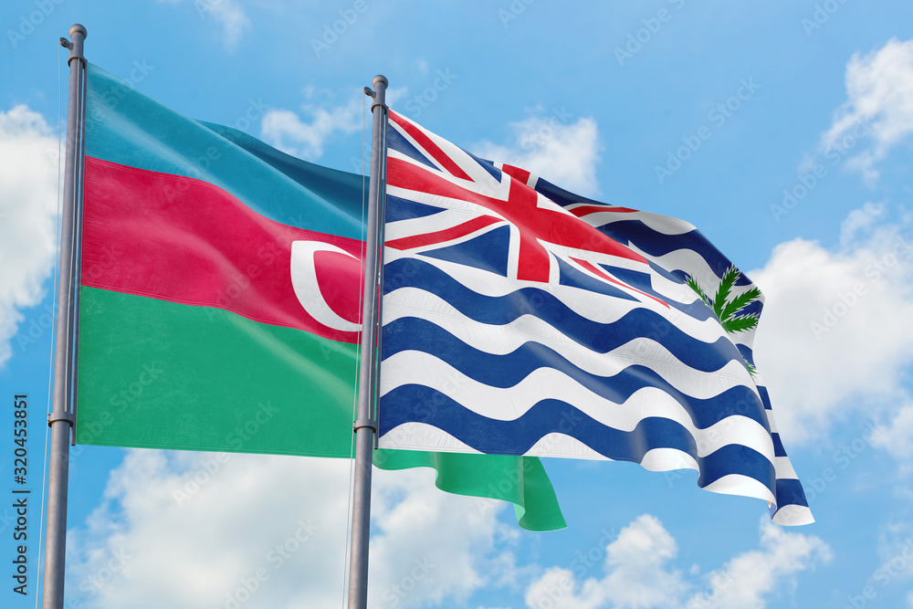 British Indian Ocean Territory and Azerbaijan flags waving in the wind against white cloudy blue sky together. Diplomacy concept, international relations.