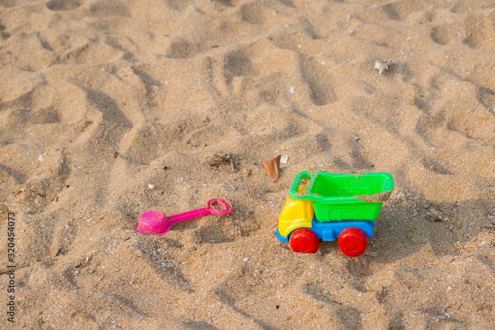 Colourful Toy car on the sand beach Colourful Toy car on the sand beach