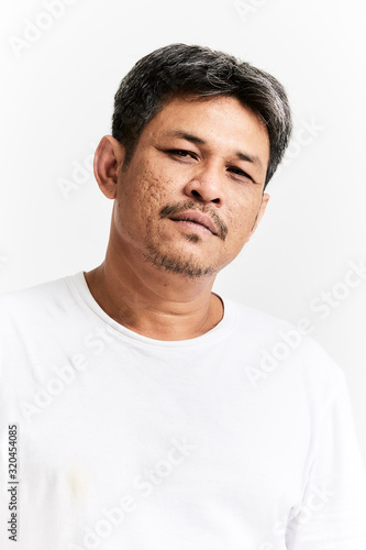 Portrait of smiling young man wearing t-shirt