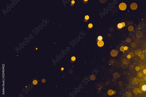Abstract gold bokeh on black © pandaclub23