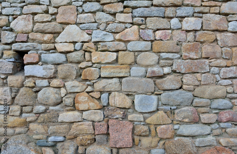Beautiful wall in granite stones in Brittany. France Beautiful wall in granite stones in Brittany. France