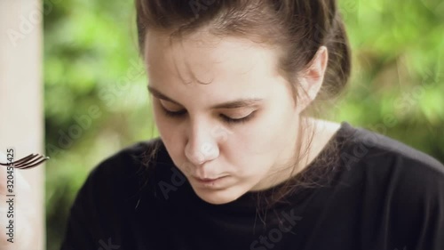 Young woman eats healthy vegan food. Rice with vegetables.