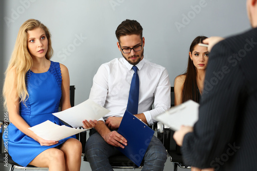 Group of people sit on casting chairs row at boss reception office portrait. Debate participation human resource fire social engineering competitor hr recruit visitor for job offer