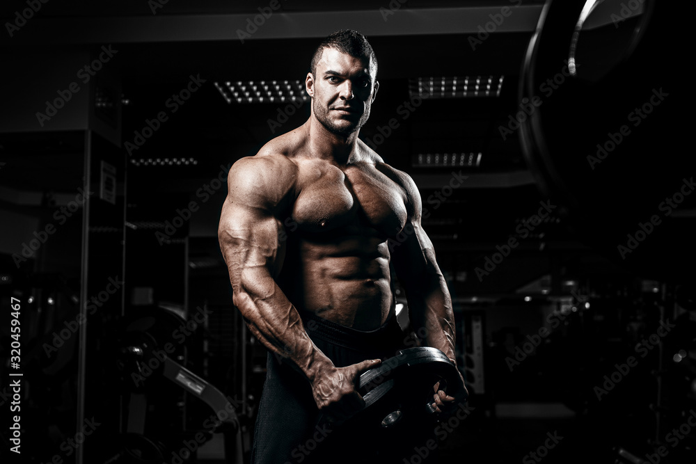 Muscular Man Bodybuilder Training Gym Posing Muscle Stock Photo by ©aallm  188095016