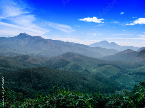 The Scenic beauty of Munnar tea plantation in Southern part of India, Kerala, with Western Ghats mountains region. © Tiby