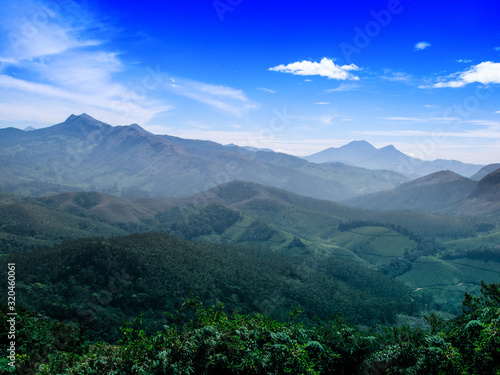 The Scenic beauty of Munnar tea plantation in Southern part of India, Kerala, with Western Ghats mountains region.