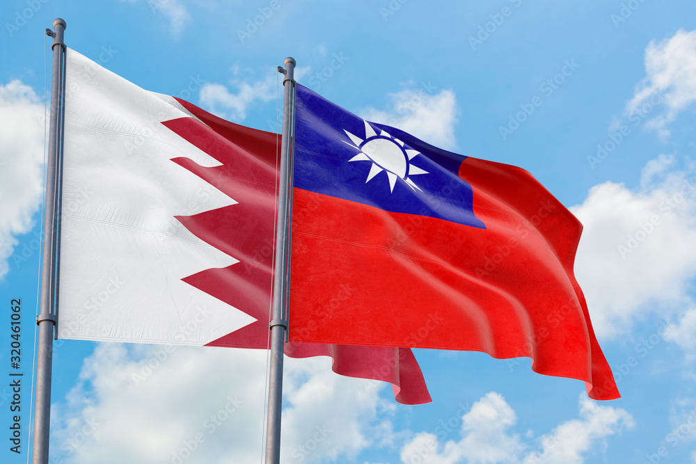 Taiwan and Bahrain flags waving in the wind against white cloudy blue sky together. Diplomacy concept, international relations. Taiwan and Bahrain flags waving in the wind against white cloudy blue sky together. Diplomacy concept, international relations.