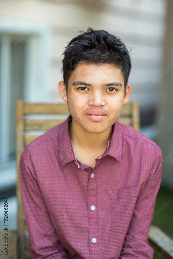 Young mixed race teenage boy looking at the camera Young mixed race teenage boy looking at the camera