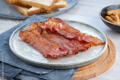 Crispy fried bacon on a plate.