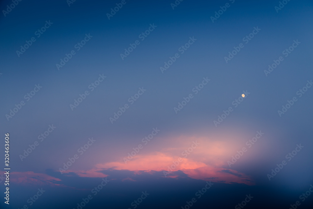 Moon and the red cloud formation during sunsets