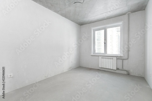empty room with wooden floor and wall