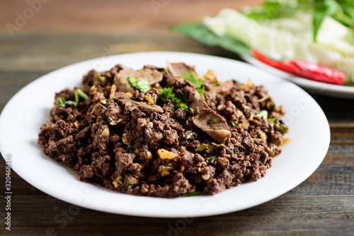 Northern Thai food, spicy minced pork salad (Larb Moo Kua) with fresh vegetables