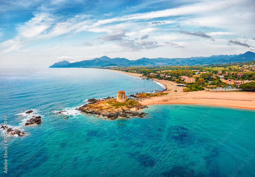 View from flying drone. Splendid spring view of Torre di Bari tower. Aerial morning scene of Sardinia island, Italy, Europe. Captivating seascape of Mediterranean sea. 