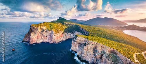 Panotamic view from flying drone. Great sunrise on Caccia cape. Breathtaking spring scene of Sardinia island, Italy, Europe. Fantastic morning seascape of Mediterranean sea.  photo