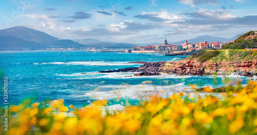 Superb spring cityscape of Alghero town. Sunny morning scene of Sardinia island, Italy, Europe. Bright Mediterranean seascape. Traveling concept background..
