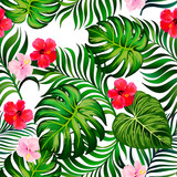 Exotic green seamless vector pattern with palm, banana and hibiscus flowers. Summer botanical backgrioud. Trendy summer print.	