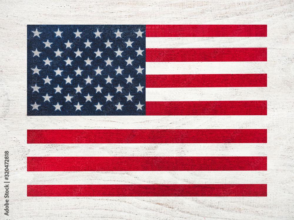 Naklejka premium American Flag lying on the table. Place for your inscriptions. Top view, close-up. National holiday concept