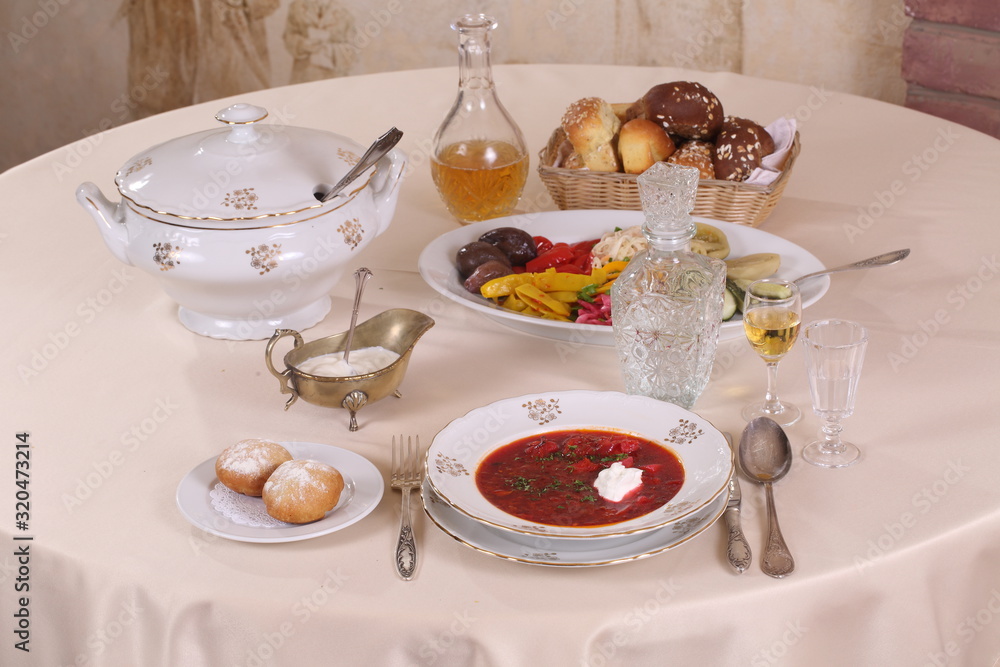 Still-life with borsch with vodka on a festive table Still-life with borsch with vodka on a festive table