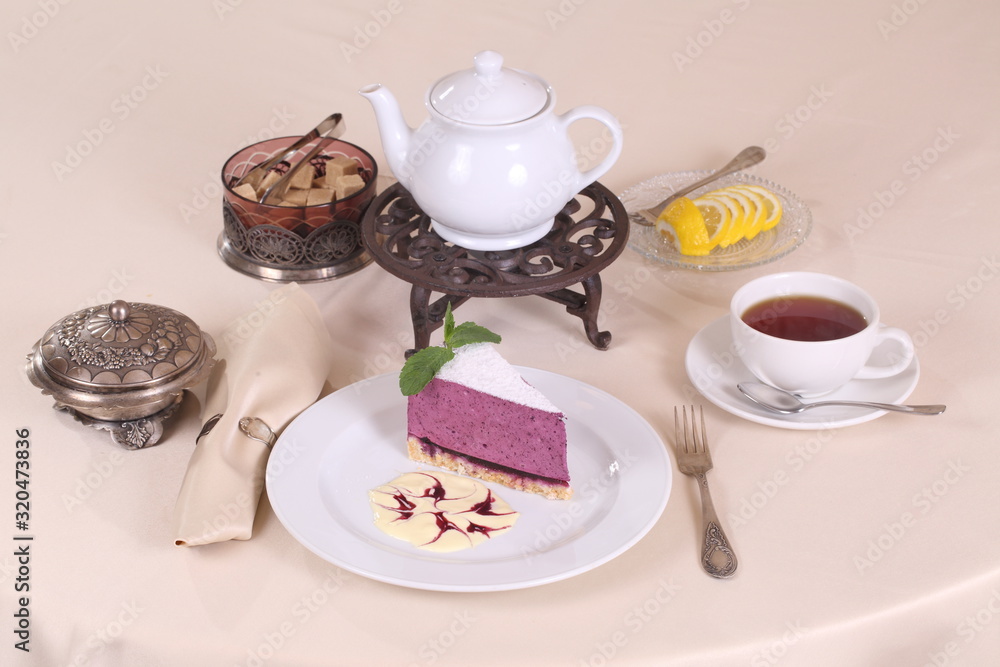 Berry cake with tea with mint and lemon Berry cake with tea with mint and lemon