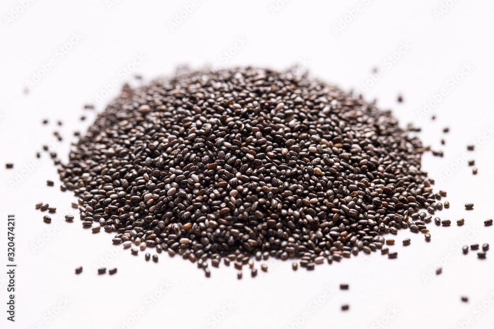 Chia seeds on a white isolated background close-up. Chia seeds on a white isolated background close-up.