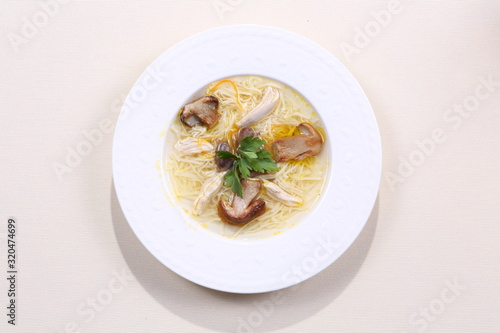 Mushroom soup on white wooden table