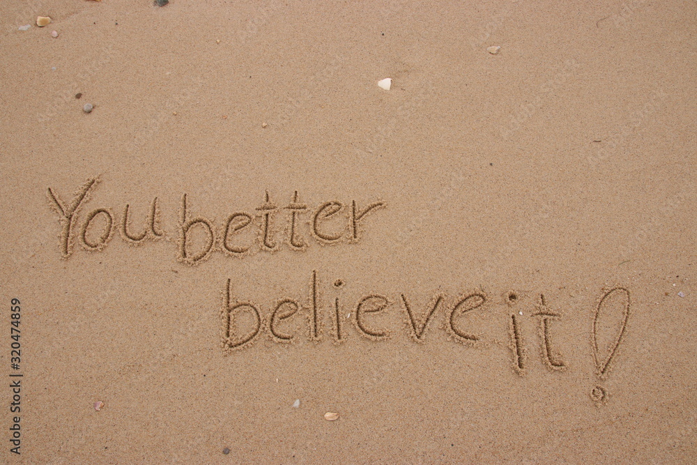 Fototapeta premium inscription on the sand, Handwriting words 