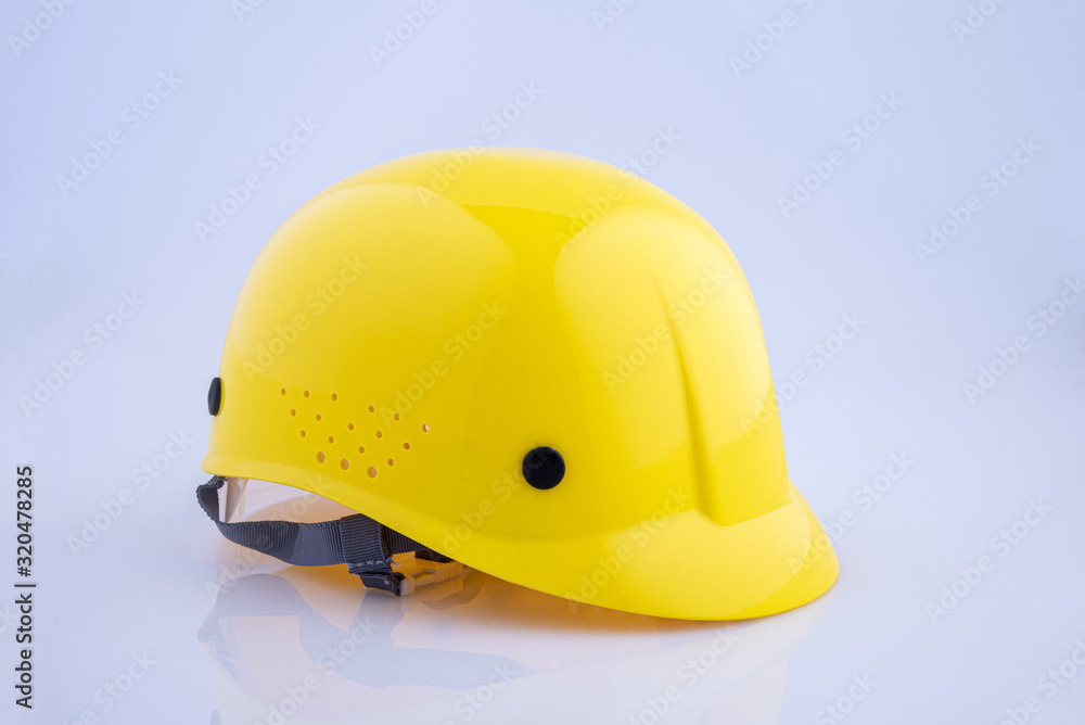 Fototapeta premium Yellow helmet isolated on white background, clipping path included
