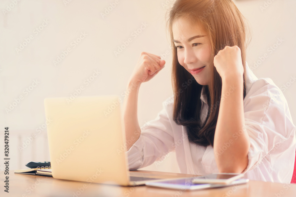 Asian business woman success celebration at office, success happy pose. E-commerce, internet technology, or startup small business concept. Asian business woman success celebration at office, success happy pose. E-commerce, internet technology, or startup small business concept.