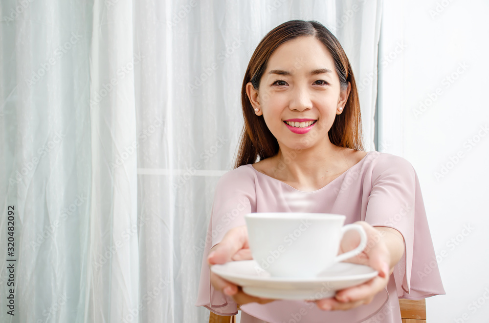 Beautiful smiling young woman hand holding take away coffee cup to her man. Beautiful smiling young woman hand holding take away coffee cup to her man.