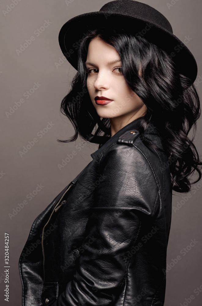 young beauty fashion model woman in hat portrait on a gray background young beauty fashion model woman in hat portrait on a gray background