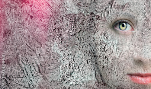 Art portrait of a face walled up in a wall