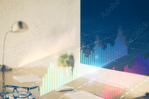 Forex graph hologram on table with computer background. Multi exposure. Concept of financial markets. © peshkova