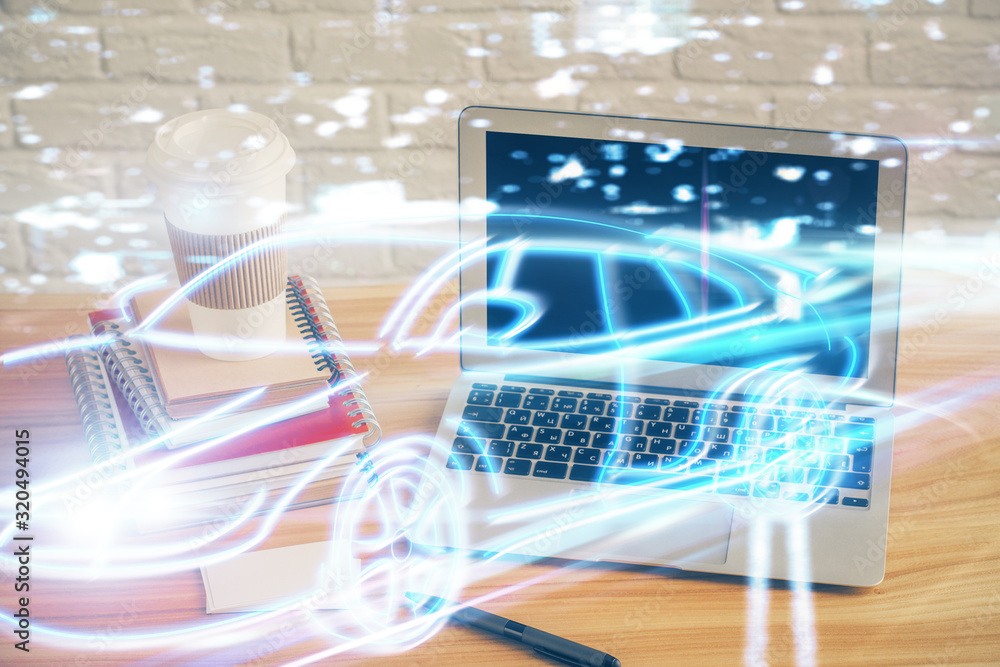 Desktop computer background in office with automobile hologram drawing. Multi exposure. Tech concept. Desktop computer background in office with automobile hologram drawing. Multi exposure. Tech concept.