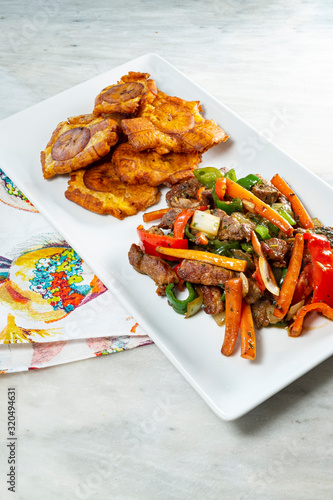 Chopped steak or Bistec Picao and patacones or tostones are fried green plantain slices, made with green plantains, Tipical Panamá food, Panamá, Central America photo