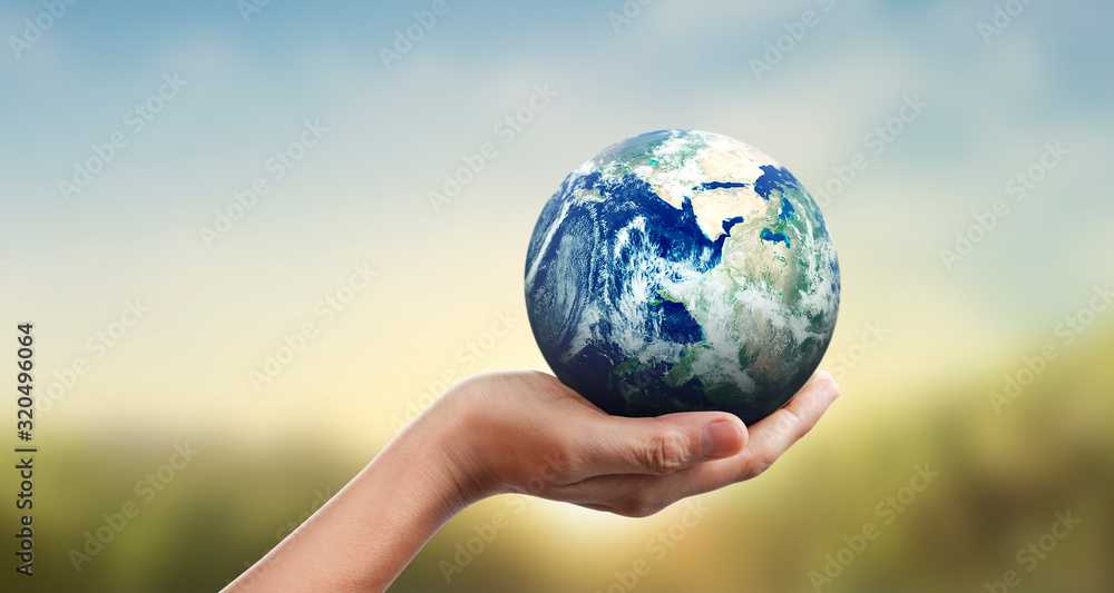 Globe ,earth in human hand, holding our planet glowing Globe ,earth in human hand, holding our planet glowing