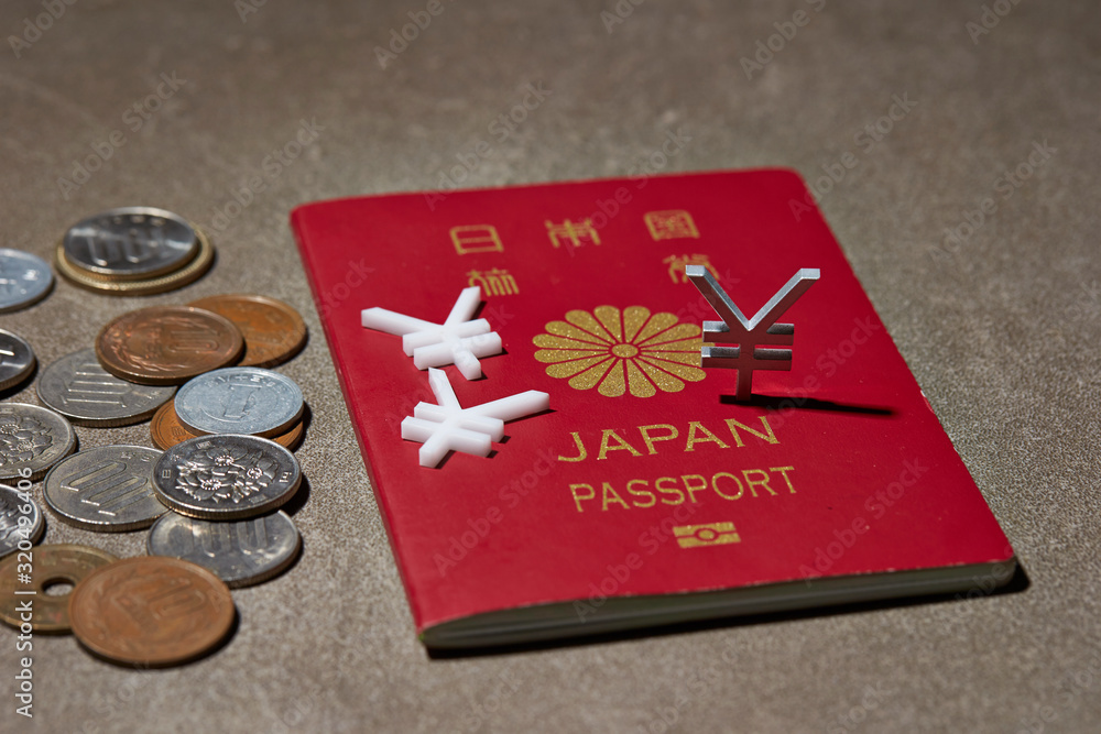 Japanese passport, coins and currency symbol Japanese passport, coins and currency symbol
