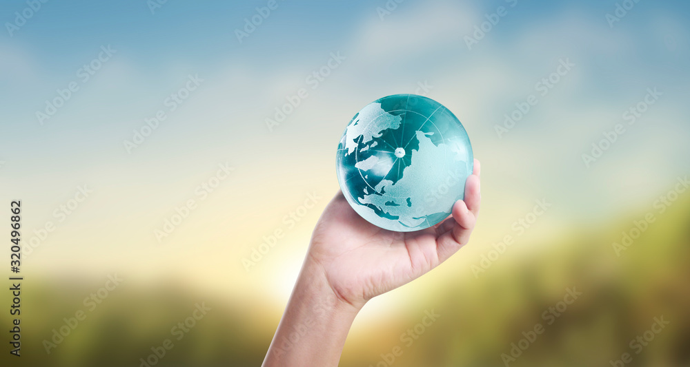 Globe ,earth in human hand, holding our planet glowing Globe ,earth in human hand, holding our planet glowing